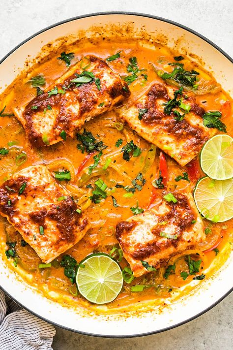 Thai-inspired Red Curry Salmon is simmered in an incredibly tasty coconut red curry sauce with bell peppers, garlic and onions. #curry #coconut #salmon #fish #healthydinner #healthyrecipes #dinner Health Food Meals, Red Curry Salmon, Coconut Salmon, Coconut Red Curry, Curry Salmon, Curry Coconut, Red Curry Sauce, Vegan Paleo Recipes, Lunch Appetizers