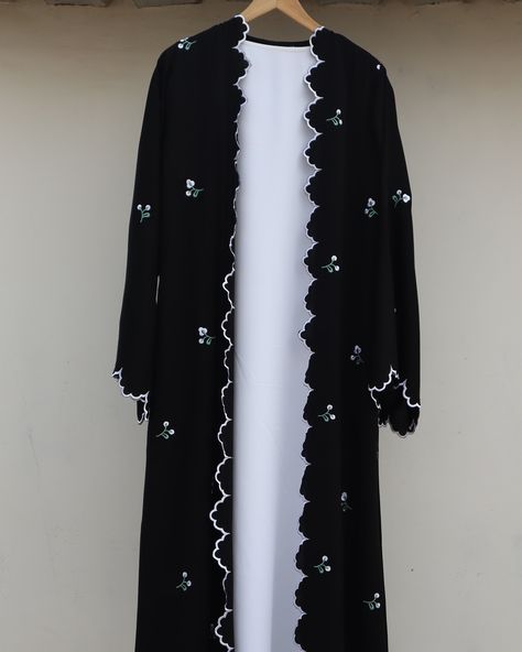 Elevate your modest wardrobe with this elegant black shrug-style abaya, adorned with delicate white cutwork embroidery on the edges and floral embroidery on back,front and sleeves…Paired with a plain white inner and matching plain white stole, this abaya effortlessly combines grace and sophistication for any occasion. . . DM for order . . Customisation available . . . #abaya #abayafashion #abayacollection #abayalovers #abayablack #shrugabaya #modestwear #modesty #modestyisgorgeous #modeststyle Black Abaya Embroidery Design, Modest Lookbook, Embroidery Abaya, Shrug Style, White Stole, Abaya Black, Modest Wardrobe, Black Shrug, Black Abaya