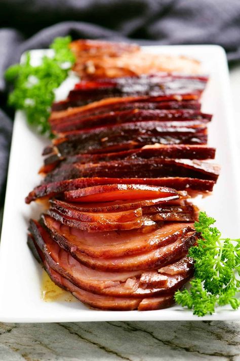 This Hot Honey Baked Ham recipe has a mouthwatering combo of sweet and spicy that's perfect for a holiday dinner or hot honey ham sandwiches! Hot Honey Glazed Ham, Hot Honey Ham Glaze, Honey Ham Sandwiches, Baked Ham Recipe, Spicy Ham, Honey Baked Ham Recipe, Ham Sauce, Hot Honey Recipe, Ham Recipes Baked