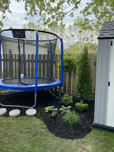 Frustrated that nothing grows under your trampoline, add it into your landscape design. Small Backyard Trampoline Ideas, Backyard Pool And Trampoline, Playset And Trampoline Landscaping, Trampoline In Backyard Ideas, Trampoline Landscaping Ideas, Landscaping Trampoline, Small Backyard With Trampoline, Landscaping Under Trampoline Ideas, Backyard With Trampoline Ideas