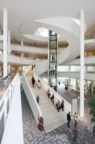 Spiral staircase that doesn't inhibit your view and is incorporated into the atrium/public area.  designed by 3XN and the building is Stadshuis Nieuwegein 3xn Architects, Escalier Design, Stairs Architecture, Cultural Centre, Sunset Strip, Spiral Stairs, Architecture Magazines, Cultural Architecture, Cultural Center