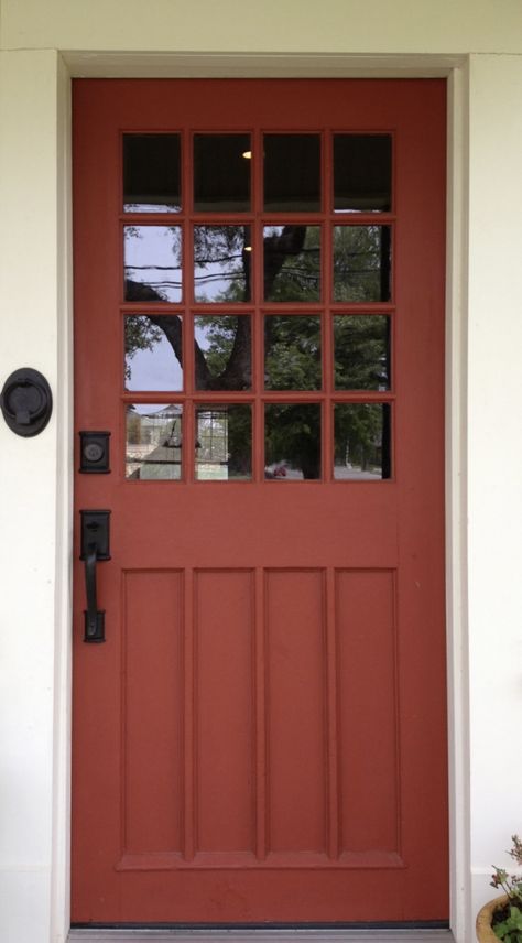 Brick Red Front Door Color, Black And White House Exterior With Colored Door, Rust Orange Front Door, Burnt Orange Door, Red Orange Front Door, Rust Colored Front Door, Red Door Colors, Rust Front Door, Gray House Red Door