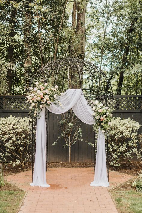 Gazebo Backdrop, Wrought Iron Wedding Arch, Gazebo Drapes Wedding, Wedding Flower Arch Gazebo, Metal Gazebo Wedding Decorations, Arch With White Draping, Wedding Ceremony Gazebo, Gazebo Wedding Decorating Ideas, Wedding Gazebo Decor