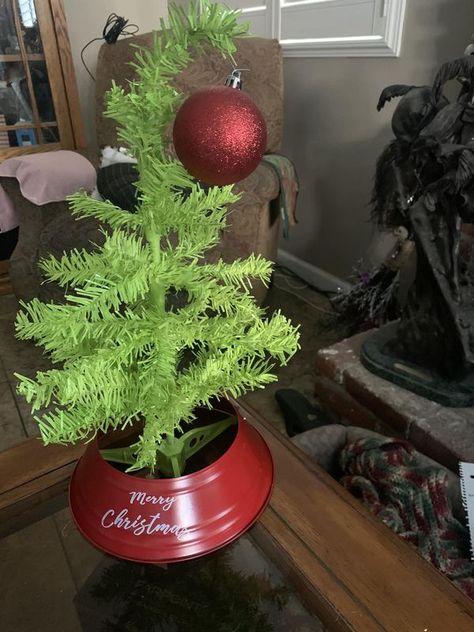 Dollar Tree crafts & DIY With Instructions | All you need to make a Grinch Christmas Tree is one white dollar tree 🌲 from the dollar store the red base also from the dollar store and spray pai... | Facebook The Grinch Christmas Tree Diy, Grinch Tree Diy, Grinch Christmas Tree Diy, Dollar Tree Grinch, Dollar Tree Grinch Ideas, Diy Grinch Tree, Make A Grinch, Grinch Christmas Decor, A Grinch Christmas