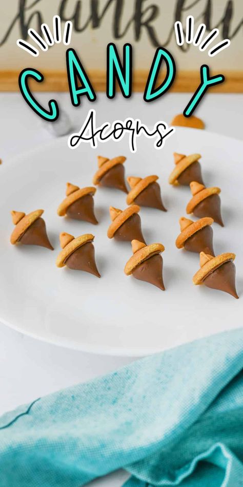 Candy Acorns are a delightful and simple treat that’s perfect for fall! Made with chocolate kisses, mini cookies, and a touch of chocolate, these bite-sized snacks resemble adorable acorns. They’re easy to make, fun to share, and add a sweet touch to any autumn gathering or Thanksgiving table. Thanksgiving Snack For Kids To Make, Acorn Candy Kisses, Candy Acorns Hershey's Kisses, Turkey Candy Treats, Thanksgiving Sweet Treats For Kids, Fall Candy Treats, Thanksgiving Candy Treats, Candy Acorns, November Treats