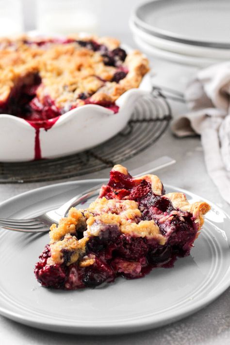 Mixed Berry Pie is made with a combination of fresh blueberries, blackberries, and strawberries that's baked into a delicious all-butter pie crust.  This pie is topped with a crumb topping for a beautiful presentation that will complement any summer gathering. #mixedberrypie #crumbtopping #thesweetoccasion Mixed Berry Pie With Crumb Topping, Mixed Berry Crumble Pie, Mixed Berry Pie With Frozen Berries, Easy Berry Pie, Berry Crumble Pie, Fresh Berry Pie, Mixed Berry Dessert, Berries Pie, Berry Pies