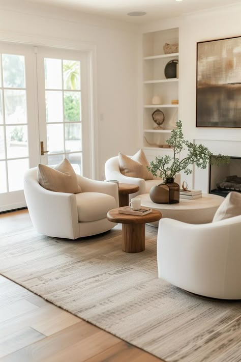 Swivel accent chairs in a neutral modern living room Easy Living Room Ideas, Modern Cottage Interior Living Room, Swivel Accent Chairs, Neutral Living Room Decor, Contemporary Living Room Chairs, Lounge Room Styling, Pottery Barn Living Room, Sitting Room Chairs, Modern Swivel Chair