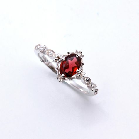 RING DETAIL Metal : 925 sterling silver Center stone : Garnet  size of stone : 5x7mm shape : Oval About gems stone GARNET . Garnet have exceptional characteristics to satisfy a wide range of vigorous needs--from improving one's essentialness and wellbeing to insurance from pessimism. Since it's such a stimulating stone, garnet is regularly utilized for appearance purposes and worn as a charm for best of luck. Notwithstanding bringing essentialness, high energy, and insurance, garnet additionally Dainty Promise Rings, Rings Art Deco, Rings Oval, Rhodolite Garnet Ring, Garnet Ring Silver, January Birthstone Rings, Red Garnet Ring, Birthstone Rings, Engagement Ring For Her