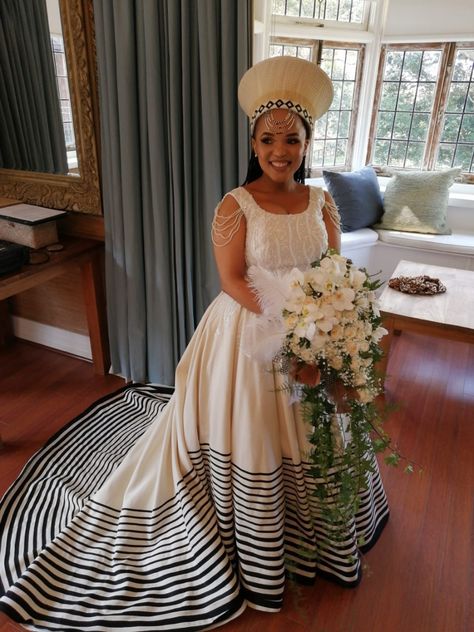 Beautiful umbhaco-inspired wedding gown for a one of a kind Xhosa bride. Umbhaco wedding dress ❤️ Xhosa Lobola Attire, Xhosa Bride Traditional Attire, African Bride Dresses Traditional, South African Wedding Dress Traditional, Xhosa Wedding Dresses Traditional, Xhosa Attire Traditional Dresses, South African Bride, Umbhaco Xhosa Designs, Xhosa Wedding Dresses