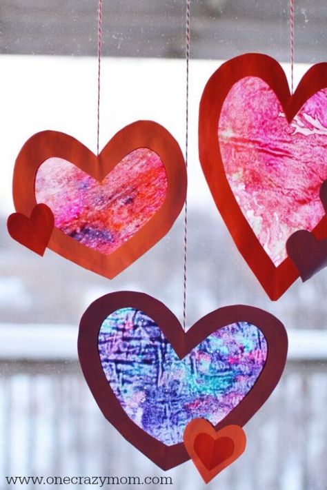 Let the kids make homemade suncatchers for the perfect Valentine's Day Craft. They will love this heart suncatcher and it's so simple to make. This Valentine’s Day craft idea is perfect for kids or adults! #onecrazymom #craftideas #valentinesdaycrafts #crafts Homemade Suncatchers, Vday Party, Heart Suncatcher, Crayon Heart, Mindfulness Art, Diy Glue, February Crafts, Easy Valentine Crafts, Valentine Craft