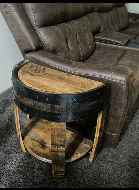 This side table is great for at the end a couch, next to your bed, or anywhere you want it to fit flat against a wall. We offer 3 color options (polyurethane finish only, chestnut, and dark walnut). We can make these anywhere from 20-24 inches tall. The top part of the lower shelf is approximately 4 inches off the ground. These are made from authentic bourbon barrels sourced from Kentucky. Want more than 1? Contact us for better pricing. ** shipping to Continental USA only. if you live in HI or Bourbon Barrel Shelf, Barrel End Table Living Rooms, Wine Barrel Side Table, Whiskey Barrel Tables, Jack Daniels Barrel Ideas, Whiskey Barrel Side Table, Whiskey Barrel End Table, Whiskey Barrel Chairs, Western End Tables