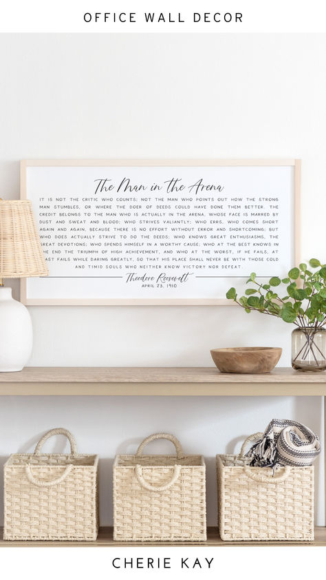 Framed wall art featuring Theodore Roosevelt's iconic 'The Man in the Arena' quote displayed on a light wood console with woven baskets, greenery, and a lamp, perfect for office wall decor, inspirational home decor, or professional workspace styling. The Man In The Arena, Motivational Signs, Man In The Arena, Welcoming Home, Inspirational Signs, Classic Interiors, Office Signs, Theodore Roosevelt, Farmhouse Look