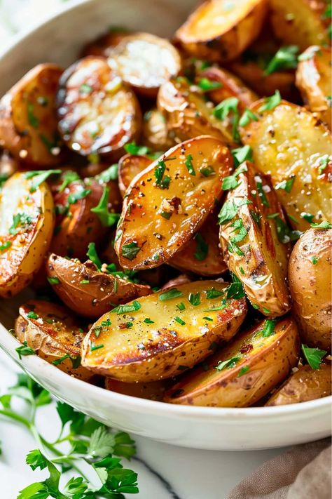 These roasted fingerling potatoes are the ultimate side dish! The crispy exterior and garlic and herb flavor is simply irresistible. Herb Roasted Fingerling Potatoes, Garlic Fingerling Potatoes, Bbq Sides Potatoes, Roasted Fingerling Potatoes Air Fryer, Roast Fingerling Potatoes, Fingerling Potato Recipe Oven, Crispy Fingerling Potatoes, Air Fryer Fingerling Potatoes, Roasted Fingerling Potatoes Oven