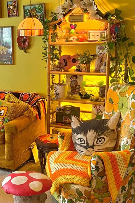 Yellow living room with cat pillow and mushroom ottoman, plus lots of retro 70s decor Vintage Wood Art, Colorful Vintage House Decor, 60 Room Aesthetic, Retro Maximalist Living Room, 60s Bedroom Aesthetic Vintage, Mural In House, Vintage Basement Decor, Granny Core Decor, Living Room Eclectic Cozy