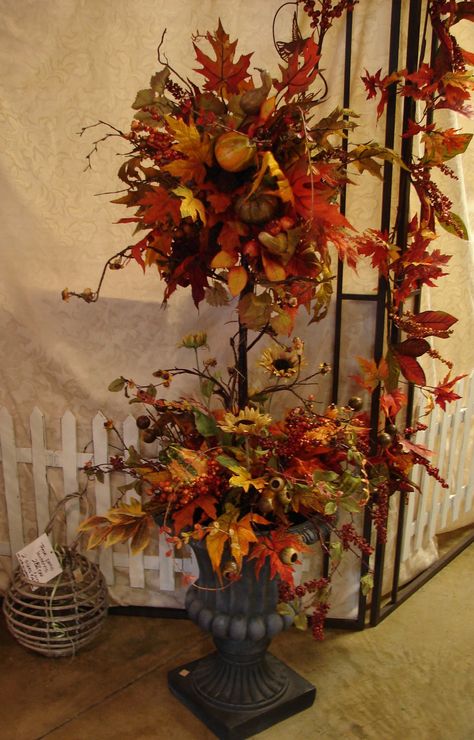 Fall topiary!  Pops out of the urn so it can be changed out for the season.  www.TheWhiteHare.com Fall Topiaries Diy, Fall Urn Arrangements, Fall Topiary Porches, Fall Topiary Ideas, Thanksgiving Topiary, Pumpkin Topiary Ideas, Fall Topiary Diy, Fall Pumpkin Topiary, Fall Topiary