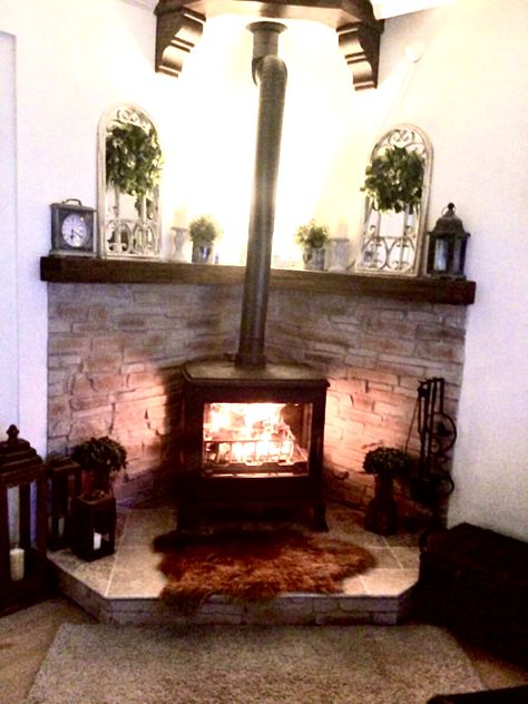 Corner Hearth Ideas, Corner Wood Burner, Wood Stove Corner Ideas, Small Corner Fireplace, Woodstove Ideas, Hobbit Stove, Corner Wood Stove, Wood Stove Surround, Corner Fireplaces