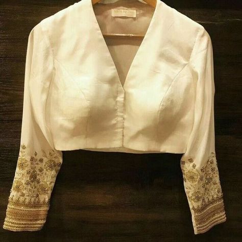 Dm@9640490158 Designer maggam work blouse Fabric: haflpattu Dispatch: 3days Price : 2000unstiched :2550 stitched Colours and sizes can be customised accordingly # Bridal #Boutiques #Blouses #long sleeves Cream Colour Blouse Designs, White Colour Blouse Design, Handwork Blouse Design Latest, Handwork Design Unique, White Saree Blouse, Handwork Designs, Long Sleeve Blouse Designs, White Blouse Designs, Saree Jacket