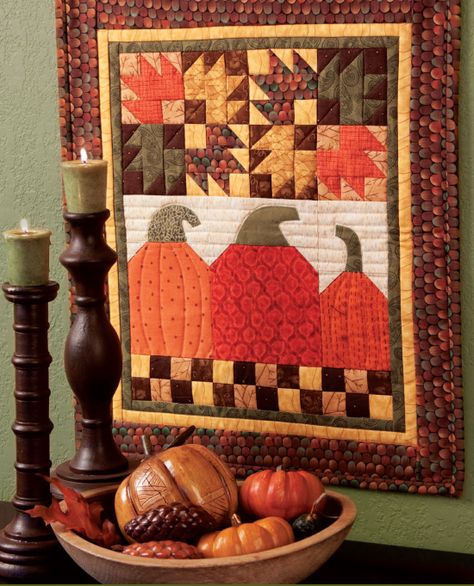 From my 25 Years of Quilts book - this is my Happy Harvest wall banner design. I love personality filled pumpkins! Quilted Accessories, Halloween Quilt Patterns, Small Quilt Projects, Fall Quilt Patterns, Debbie Mumm, Painted Barn Quilts, Happy Harvest, Quilted Wall Hanging, Fall Sewing