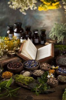 Herbal medicine and book on wooden table background by JanPietruszka Vectors & Illustrations  with Unlimited Downloads - Yayimages Wooden Table Background, Holistic Doctor, Table Background, Medical Herbs, Magic Herbs, Essential Oil Blends Recipes, Healing Space, Medicine Doctor, Holistic Medicine