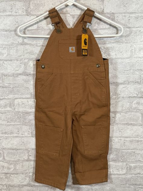 Get your little one ready for some outdoor adventures with these Carhartt brown overall bibs. Made for unisex baby and toddler wear, these one-piece outfits are perfect for keeping your child cozy and stylish. The overalls feature a durable design and come in size 2T, making them a great choice for parents looking for high-quality toddler clothing. Ideal for both boys and girls, these Carhartt overalls are a must-have for any parent looking for a practical and fashionable addition to their child's wardrobe. With a classic brown color and a stylish overall style, these bibs are perfect for any occasion. Plus, they're brand new with tags, so you can be sure you're getting the best quality possible. Carhartt Kids, Carhartt Overalls, Toddler Wearing, Overall Style, Classic Brown, Toddler Clothing, One Piece Outfit, Baby & Toddler Clothing, Baby And Toddler