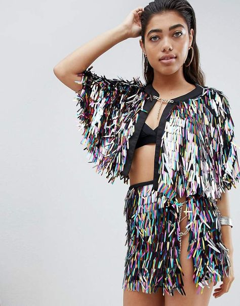 Jaded London Festival Cape In Holographic Sequins. Cape by Jaded London, Goes to a festival once, Holographic finish, Round neck, Open front, Adjustable chain fastening, Relaxed fit. Inspired by global street-style from East London to LA and New York, super-cool streetwear label Jaded London provides your fix of pretty prints and techno fabrics. If Beyonces done it head-to-toe then you know youre onto a good thing. {affiliate link} #festival #festivalfashion #festivalcape Festival Cape, Beautiful Swimwear, Techno Outfit, Burning Man Costume, Festival Outfits Rave, Rave Costumes, Outfits Rave, Burning Man Outfits, Jaded London