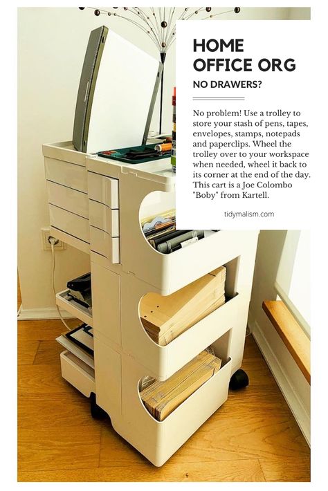 Photo of a white Joe Colombo "Boby" cart from Kartell, in a bright corner with natural light. The cart holds tidily stacked envelopes, washi tapes and miscellaneous office supplies. On the top left of the cart is an upright Sonos speaker. Behind the speaker is a 1970's vintage black wire decoration. The room has white walls and oak parquet. The cart can be wheeled out during work, and wheeled back to the corner at the end of the day. It has drawers which could also fit a laptop and power cables. Bobby Trolley, Rolling Drawers, House Improvement, 80s Home, Mobile Workstation, 80s Interior, Work Supplies, Joe Colombo, Retro Office