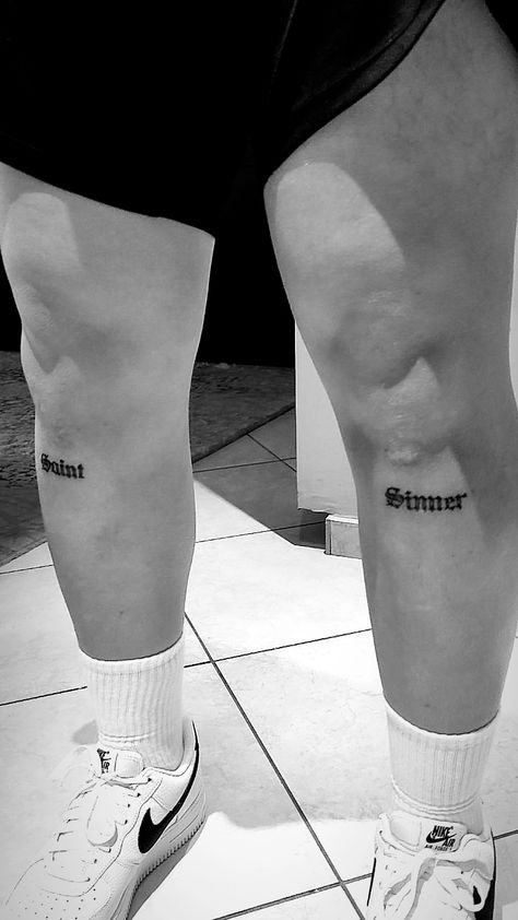 Script Over Knee Tattoo, Sinner Saint Tattoo Design, Men Tattoo Lettering, Saint Word Tattoo, Word On Knee Tattoo, Text Knee Tattoo, Leg Word Tattoo Men, Saint Tattoo Word, Tattoo On Legs For Men Ideas