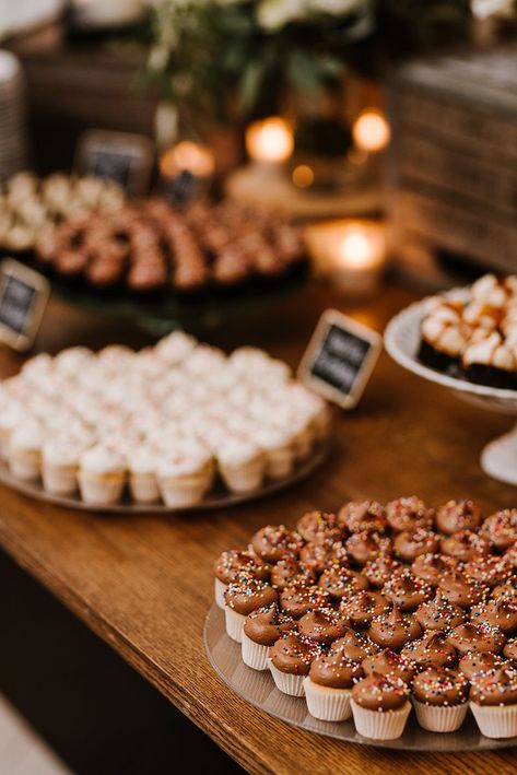 Fun dessert bar for shower, celebration, or wedding. Farm cart with mini cupcake display Briar Barn Inn, an inn and restaurant south of Newburyport, Massachusetts. BriarBarnInn.com | Annmarie Swift Photography Mini Cupcake Table Display, Wedding Mini Cupcakes Display, Modern Cupcake Display, Mini Muffin Display, Mini Cupcake Wedding Display, Open House Dessert Ideas, Mini Cupcake Display Ideas, Homecoming Desserts, Mini Cupcakes Display