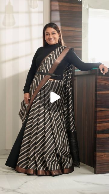 Dolly Jain 🇮🇳 on Instagram: "#SAREELS 425
The reel you’re watching today has a special story behind it. Every reel I create has a message related to a saree, a moment, or an emotion.

About a month ago, I received this saree but due to my constant travel, I didn’t have the chance to open and appreciate it until the day before the shoot. When I finally took a look at it, I instantly fell in love with the fabric and texture. That’s when I decided to try something different with it instead of the usual drape. I opted for a unique D’Coat bell style.

It was a fun experience draping this saree with the D’Coat bell. The first shot in the reel was actually taken without me noticing, as I was completely absorbed in the music playing in the background.

Every saree has its own story to tell, and Saree With Boots Look, Unique Saree Draping Style, Dolly Jain Dupatta Draping, Two Saree Draping Styles, Saree With Dupatta Draping, Saree With Coat, Dupatta Draping Styles On Suit, Dolly Jain Saree Draping, Unique Saree Draping