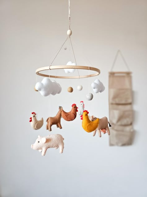 The farm baby mobile brings a charming country farmhouse feel to your little one's nursery. Featuring adorable animals like a cow, goat, chicken, and pig, this delightful mobile is perfect for adding a touch of animal nursery decor to create a cozy and playful environment for your baby. ☑️ BABY MOBILE INCLUDES: - 1 pig - 1 cow - 1 goat - 4 small chickens  - 4 clouds - 3 felt balls ☑️ You can also buy music box ➡️ www.etsy.com/listing/1162035340 💛 If you have any questions about the product, fee Pig Themed Nursery, Chicken Nursery Theme, Chicken Themed Baby Shower Ideas, Farm Nursery Ideas, Farmer Nursery, Baby Farm Animals Nursery, Farmhouse Baby Nursery, Farm Nursery Boy, Farm Animals Nursery Theme