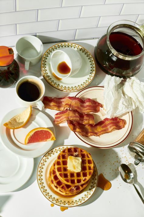 A counter adorned with the aftermath of a breakfast date, featuring coffee, pancakes, and bacon, styled to casual perfection by Lindsay Champanis with The Spin Style Agency, encapsulating the intimate and cozy vibes of breakfast in bed ideas and leisurely morning moments. American Cafe Design, Breakfast Lifestyle Photography, Dinner Table Photography, 80s Breakfast, Retro Food Photography, Food Photography Instagram, Waffles And Bacon, Breakfast Stories, Breakfast Scene Photography