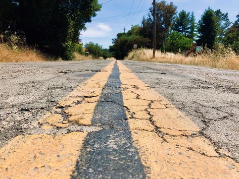 This road located in the desert is very dry, rugged and cracked. Cracked Sidewalk, Cracked Road, Climate Art, Road Drawing, Creepy Vintage, Camp Vibes, Dirt Road, In The Desert, Vintage Doll