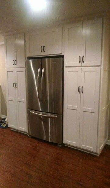 Pantry cabinets around cabinet depth fridge Cabinets Around Fridge, Farmhouse Pantry Cabinet, Laundry Combo, Farmhouse Pantry Cabinets, Folding Cabinet, Inside Kitchen Cabinets, Pantry Redo, Cabinet Depth, Fridge Pantry