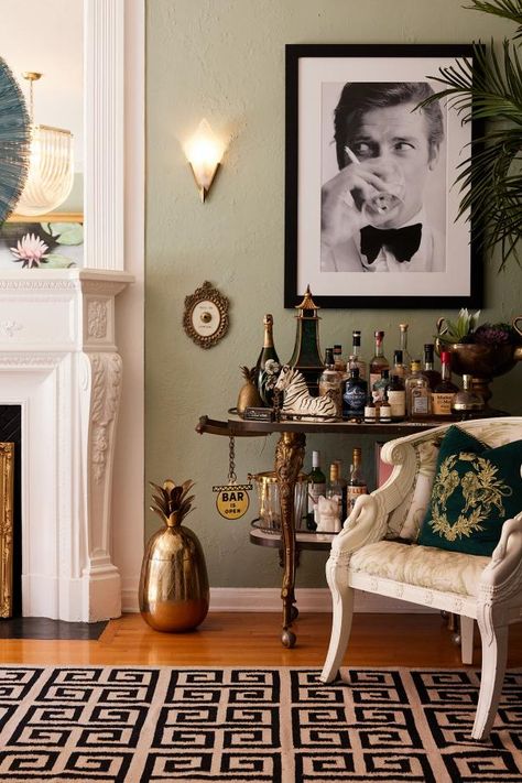 Pale Green Hollywood Regency Living Room With Photography and Vintage Bar Old Hollywood Living Room, Bookcase With Books, Modern Los Angeles Home, Hollywood Regency Interior Design, Regency Interior Design, Hollywood Regency Living Room, Regency Living Room, Los Angeles Apartment, Styling A Bookcase