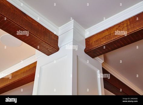 Elegant Crown Molding and Wooden Beam Detail - Interior Design Perspective Stock Photo - Alamy Wood Beams On Ceiling With Crown Molding, Crown Molding With Beams, Ceiling Beam Decoration Ideas, Wood Beams With Crown Molding, Interior Design Perspective, Painted Beams, Ceiling Classic, Wood Baseboard, Wood Crown Molding