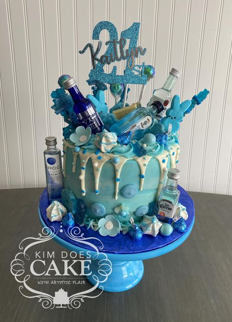 21st birthday cake in blue theme. Booze, candy and cookies. Contact Kim Gifford at Kim Does Cake (614) 207-3628 or kimdoescakes@gmail.com. I also have a Facebook page- Kim Does Cakes. https://www.facebook.com/kimdoescakes. A central Ohio baker specializing in artistic cakes. Blue And White 21st Birthday Cake, Blue Themed 21st Birthday, Pink And Blue 21st Birthday, 21st Birthday Ideas Blue Theme, 21st Birthday Blue Theme, Blue 21st Birthday Cake, Blue 21st Birthday Ideas, Blue 18th Birthday Cake, 18th Birthday Cake Blue