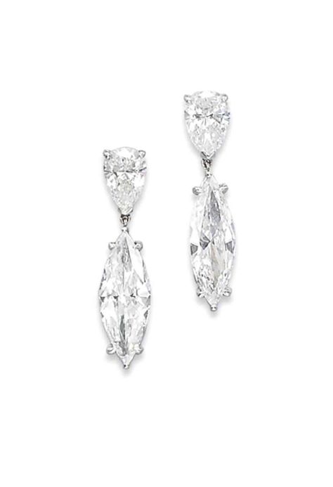 A PAIR OF DIAMOND EARRINGS. The two marquise-cut diamond pendants, weighing 2.46 and 2.01 carats, suspended from pear-shaped diamond tops, mounted in platinum and gold, 3.9 cm, with Austrian maker's mark. White Diamond Jewelry, Diamond Tops, Magnificent Jewels, Tiaras Jewellery, Diamond Pendants, Fantasy Closet, Pear Cut Diamond, Ear Rings, Crown Jewels