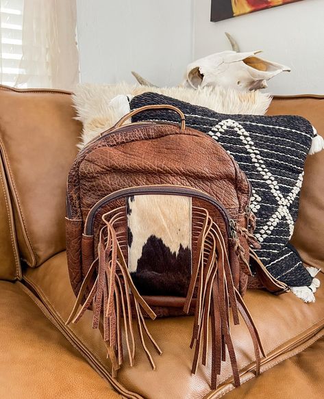 It’s A Good Day For A New Purse 🖤 #texasstyle #texasfashion #Texasrodeo #westernfashion #westernway #rodeostyle #rodeofashion #nfr #nfrfashion #nfrstyle #rodeoboutique #rodeolifestyle #rodeostyle #cowgirl #barrelracee #cowgirlstyle #cowgirlfashion #rodeooutfit #rodeochic #westerncouture #westernchic #rodeochic #westernflare #cowprint #westernhome #westernchic #cowboystyle #cowboyhome Fall Backpack, Western Bags, Rodeo Chic, Country Boutique, Nfr Style, Texas Fashion, Nfr Fashion, Western Bag, Glam Boho