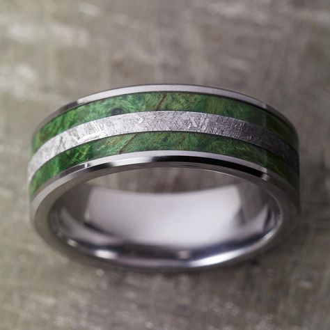 This meteorite ring has two inlays of green box elder burl flanking the gibeon meteorite center. Polished and tough tungsten makes up the sleeve of this unisex wedding band.This wood ring comes with FREE Ring Armor Waterproofing (a $75 value).RING LAYOUT - Tungsten Wedding Band for Man with Green Box Elder Burl and Meteorite Ring-3956 Ring Width: 8 mm Ring Sleeve: Tungsten Ring Profile: Beveled Ring Finish: Polished1 mm Tungsten 2 mm Green Box Elder Burl 2 mm Gibeon Meteorite 2 mm Green Box Elde Wedding Ring Emerald Green, Green Men’s Wedding Band, Male Engagement Ring Green, Men’s Green Wedding Ring, Peridot Wedding Band Men, Mens Green Wedding Bands, Emerald Mens Wedding Band, Green Wedding Rings For Men, Wedding Rings For Men Unique