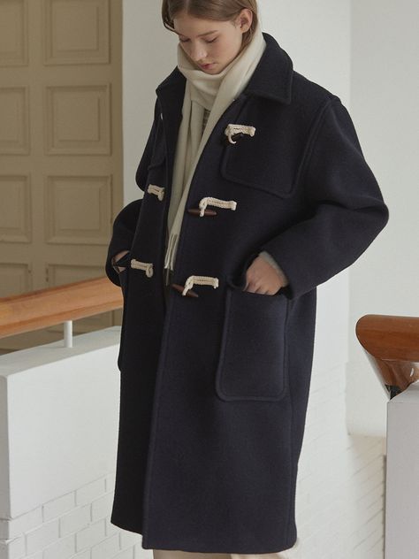 Editor's NotesThis is a plain duffle coat designed in a semi-oversized fit. It's a classic duffle coat design that stands out with a relaxed and stable silhouette. - Offering a casual yet feminine image  versatile for coordination with various inner layers- With big-sized front outer pockets to enhance the practicality- The coat enhanced with front bonding processing for higher quality* Imperfections in thread trimming  due to being done by hand  during the manufacturing process are not considered defects.Measurements(in.)One Size(XS-M)- Total Length: 42.13 in.- Chest: 23.82 in.- Shoulder: 19.49 in.- Sleeve Length: 22.24 in.- Sleeve Width: 6.69 in.* Model info: Height 5â 74â Bust 32.5â Waist 25' Hip 35'* Measurements are based on one si Navy Winter Coat, Duffel Coat, Navy Coat, Duffle Coat, Coat Outfits, Coat Design, Coat Fashion, Manufacturing Process, Winter Coat