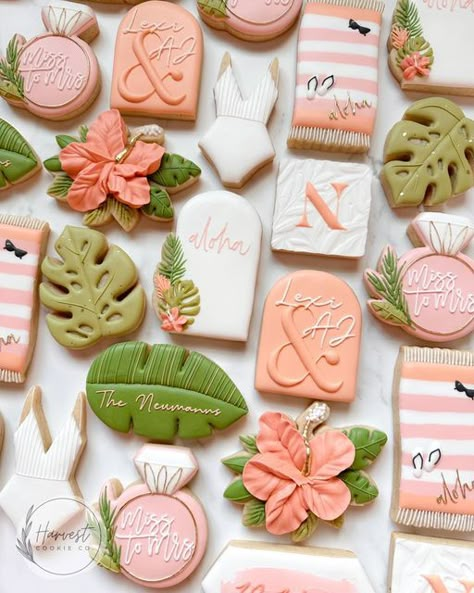 Custom Cookie Artist - Omaha/Ft.Calhoun on Instagram: "Miss to Mrs. 🌺💍 The dreamiest, tropical couples shower set. I had SO much fun making this order and designing all of the little personalized details. Does anyone see the mistake in the first photo though? I have the N cookie upside down. 🙃😂 towel inspired by @yolanda_gampp names & arch inspired by @biggestlittleconfectionery square @heysugarrex monstera leaf, hibiscus, ring @charlson_cookieco swimsuit, arch, floral arch, tropical leaf Classy Tropical Bridal Shower Ideas, Tropical Bridal Shower Cookies, Tropical Couples Shower Ideas, Luau Wedding Shower Ideas, Island Theme Bridal Shower Ideas, Aloha Bridal Shower Ideas, Hawaii Bridal Shower Ideas, Tropical Wedding Shower Ideas, Bridal Shower Tropical Theme