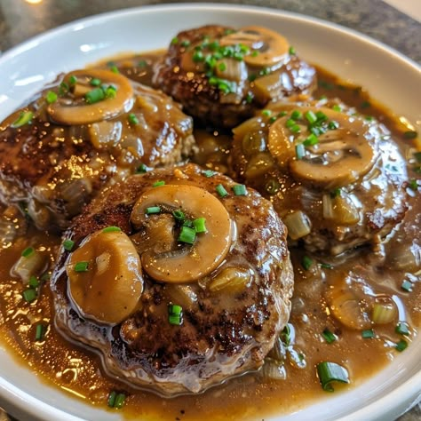 🥘 Comfort food at its best! Try our Slow Cooker Salisbury Steaks tonight! #EasyDinners 🍽️ Slow Cooker Salisbury Steaks 🛒 Ingredients: Ground beef: 1 lb Bread crumbs: 1/3 cup Egg: 1 Onion soup mix: 1 packet Mushroom soup: 1 can Milk: 1/4 cup Water: 1/2 cup 👩‍🍳 Instructions: Mix: Combine beef, bread crumbs, and egg. Form into patties. Cook: Place in slow cooker. Top with soup mix, milk, and water. Set: Cook on low for 5 hours. 🥘 Savor the flavors of homemade comfort with our easy slow cooke... Salisbury Steak With Mushroom Gravy, Beef Bread, Party Food Catering, Steak With Mushroom Gravy, Salisbury Steaks, Slow Cooker Salisbury Steak, Beef Steak Recipes, Mushroom Gravy, Salisbury Steak