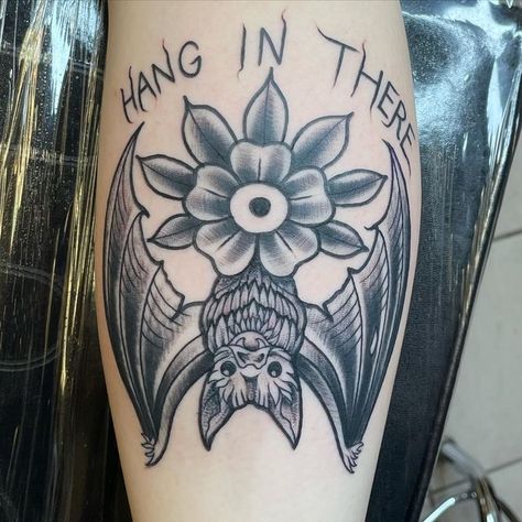 Hang In There Bat Tattoo, Halloween Shin Tattoo, Spooky Theme Tattoo, Bat Hanging Tattoo, Modern Flash Tattoo, Hang In There Tattoo, Spooky American Traditional Tattoo, Trad Bat Tattoo, Traditional Ghost Tattoo