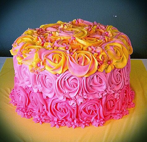 Pink and Yellow Ombre Rosette Cake Yellow And Pink Birthday Cake, Pink And Yellow 1st Birthday Cake, Ombré Rosette Cake, Yellow Ombre Rosette Cake, Rosette Cakes, Pink Ombre Rosette Cake, Ombre Rosette Cake, Rosette Cake, Yellow Ombre