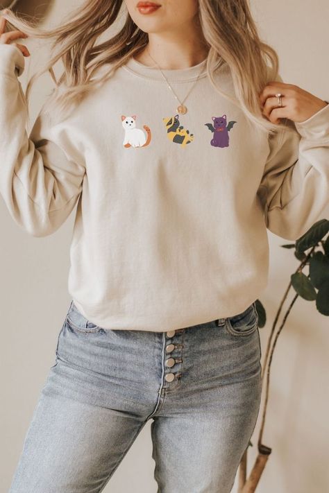 These super soft cat costume halloween sweatshirts are the perfect way to jump into spooky season. #halloweensweatshirt #giftforher #halloweencrewneck #catsweatshirt #ghostsweatshirt #catloversweater #fallsweatshirt #ghostvampirebatcostume #halloweencostume #catincostume Cloud Tshirt, Mama Pullover, Rainbow Sweatshirt, Mom Apparel, Cheer Tshirts, Cheer Mom Shirts, Vintage Christmas Sweaters, Mama Sweater, Leggings Style