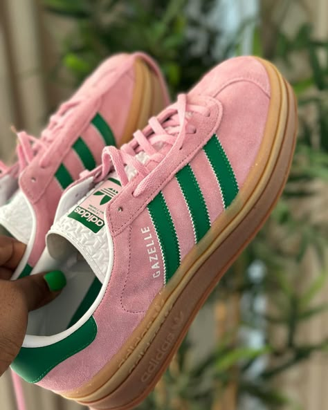 You have to hurry before they sell out like the red Gazelle😩 These are bold and vibrant - exactly what you need to make your outfit pop in summer. Love the pink and green combo. So unusually beautiful 💚💗 These are women’s sizing. I wear size 42 so I bought a size US 10 which is a size 42 2/3 in Adidas. Long story short, BUY YOUR TRUE SIZE! Sneakers are linked in bio. Comment “SHOP” if you want to receive info to your DM. #adidasgazelle #adidassneakers #sneakerspics #adidaslover Adidas Giselle Shoes, Green And Pink Shoes, Gazzels Shoes, Pink And Green Shoes, Gazelles Adidas, Red Gazelle, Adidas Gazelle Green, Pink Adidas Shoes, Adidas Gazelle Shoes