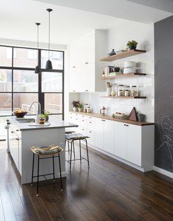 Kitchen, Dark Hardwood Floor, Drop In Sink, and White Cabinet Kitchen stools from One Forty Three; steel and glass doors by A&S Steel Windows. Kitchen Dark Wood, Kitchen Dark, Scandinavian Kitchen Design, White Subway Tiles, Scandinavian Kitchen, Wood Counter, White Kitchen Cabinets, Kitchen Stools, Large Homes