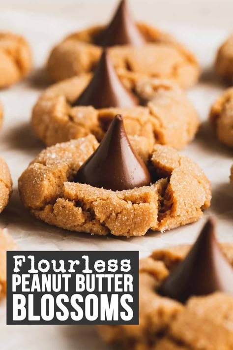 Flourless peanut butter blossoms are the new gluten-free twist on these classic Christmas cookies! This cookie recipe is so easy to make with only a handful of ingredients. Everyone loves this chewy peanut butter cookie with a Hershey's Kiss on top. Since it's flourless, this recipe is gluten-free and grain-free. It's also dairy-free! Gluten Free Peanut Blossoms, Peanut Butter Blossom Cookies Gluten Free, Gluten Free Peanut Butter Kiss Cookies, Flourless Peanut Butter Blossoms, Gluten Free Blossom Cookies, Gluten Free Hershey Kiss Cookies, Gluten Free Kiss Cookies, Easy Gluten Free Desserts Christmas, Easy Christmas Cookies Gluten Free