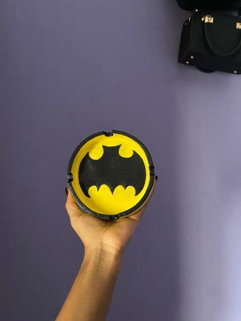 Batman themed clay ashtray, with black lines Batman Clay, Ashtray Painting Ideas, Clay Jewellery Holder, Hayday Farm Design, Lip Scrub Diy, Pressed Flower Crafts, Painted Pots Diy, Ceramic Ashtray, Diy Birthday Gifts For Friends