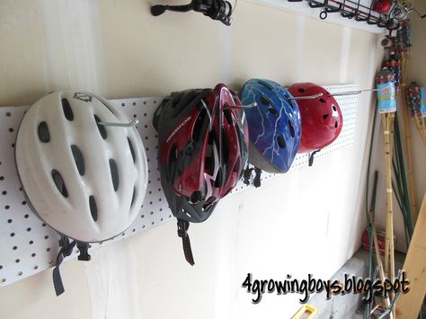 4 Growing Boys: Bike Helmet Organizing Rack Made From Pegboard Bike Helmet Storage, Bike Storage Apartment, Bicycle Storage Rack, Indoor Bike Rack, Helmet Rack, Indoor Bike Storage, Bicycle Hanger, Outdoor Bike Storage, Cool Bike Helmets